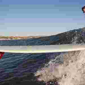 Nathan Adams surfing a log and later the pleasant phesant single fin.